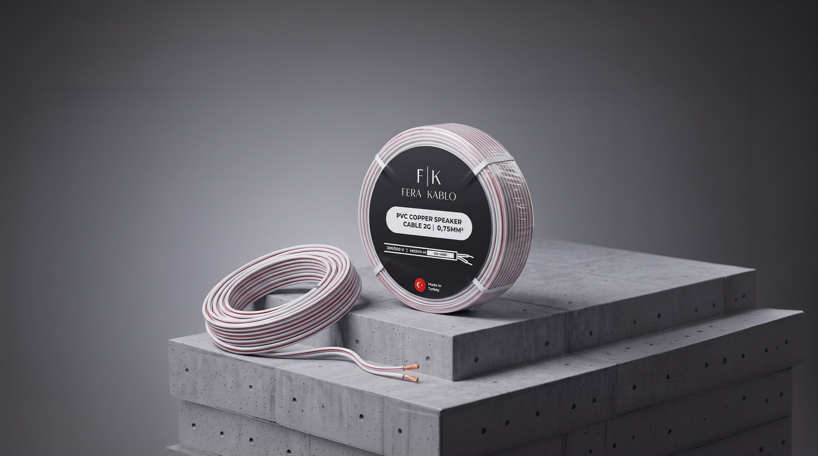 Fera Kablo PVC copper speaker cable: a labelled coil standing beside a loose coil on concrete
